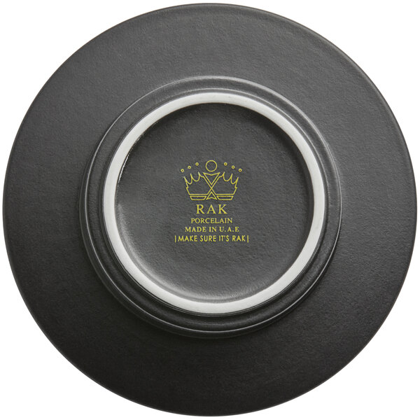 A white porcelain saucer with a red rim and a logo in the center.