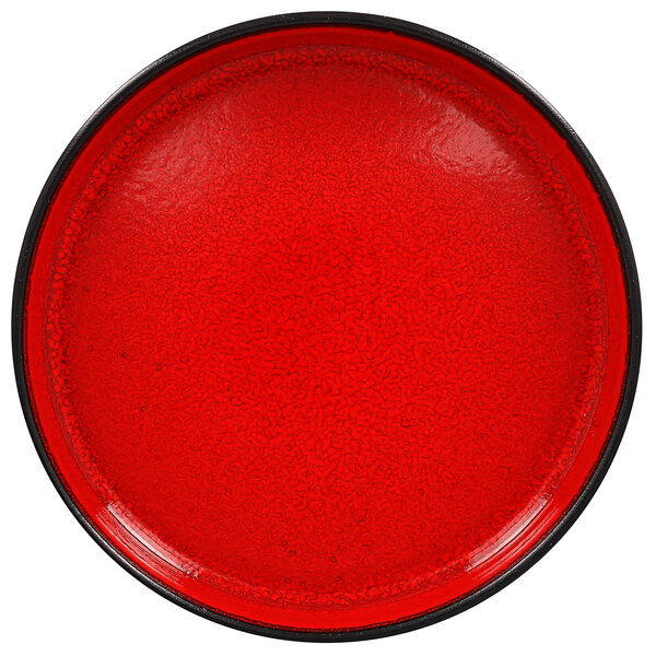 A red porcelain plate with a black rim.