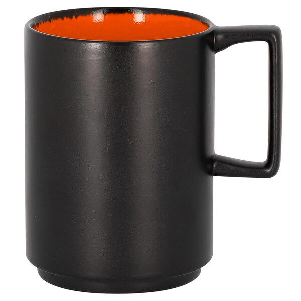 a black and orange coffee mug