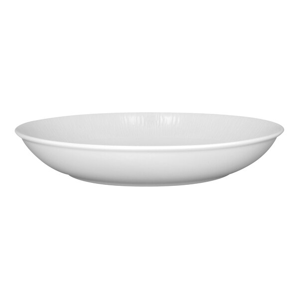 A bright white embossed deep coupe porcelain plate.