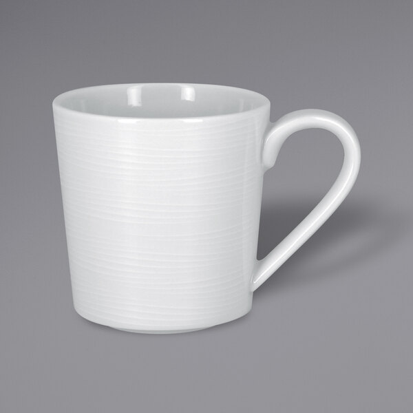 a white mug with a handle