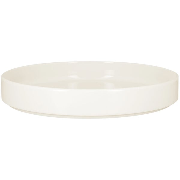 a white bowl with a black handle