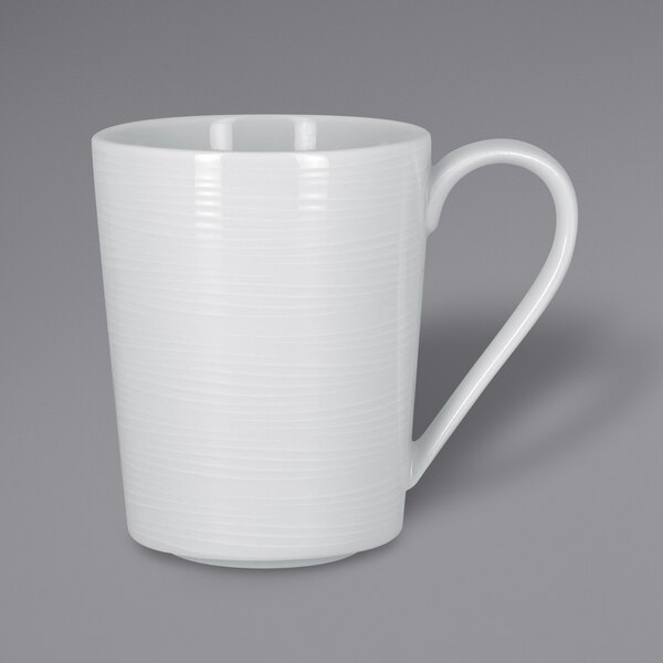 A RAK Porcelain bright white mug with a handle.