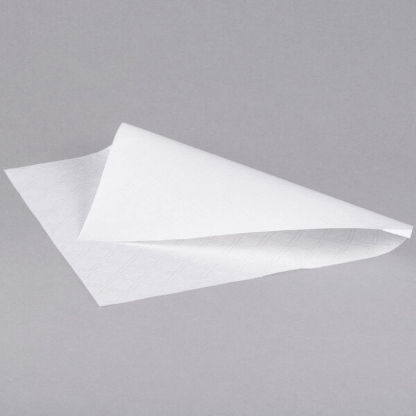 A folded white Bagcraft Packaging deli sandwich wrap paper towel.