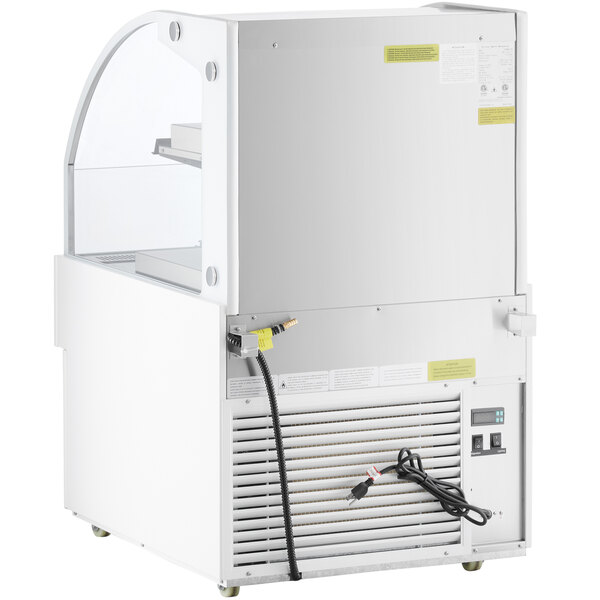 An Avantco white horizontal air curtain merchandiser with a glass door.