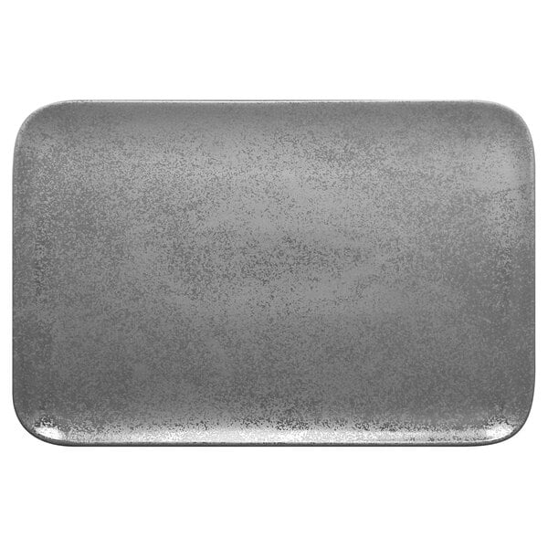 a grey rectangular object with specks