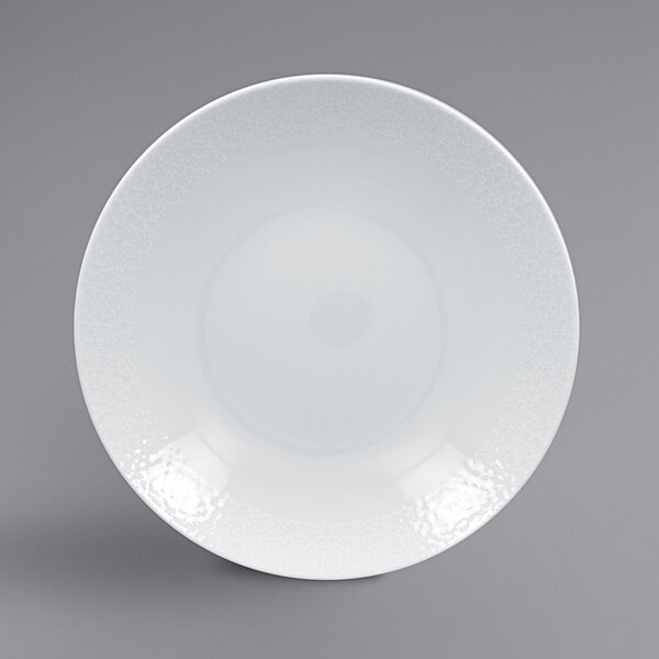 A RAK Porcelain bright white deep coupe porcelain plate with a textured pattern.