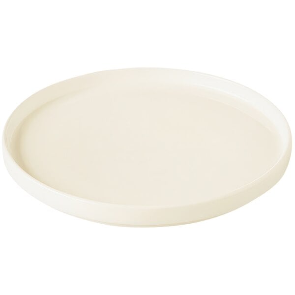 A RAK Porcelain warm white round porcelain plate with a rim.