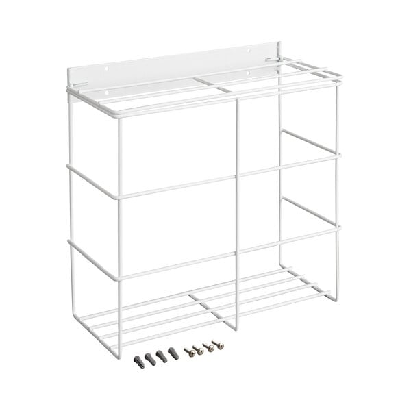 A white metal wire rack with two compartments and mounting hardware placed in front.