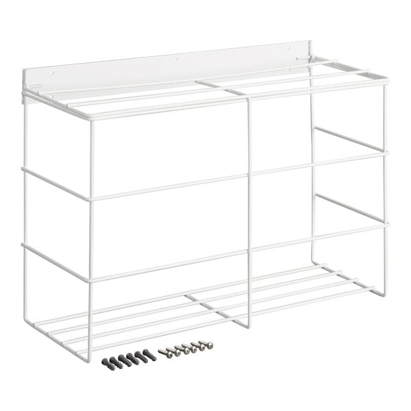 A white metal wire rack with three compartments and mounting hardware placed in front of it.