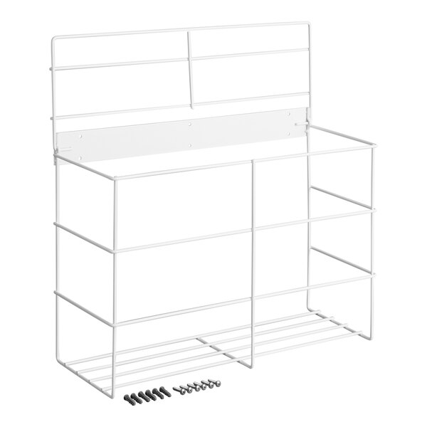 A white metal wire rack with three compartments and mounting hardware placed in front of it.