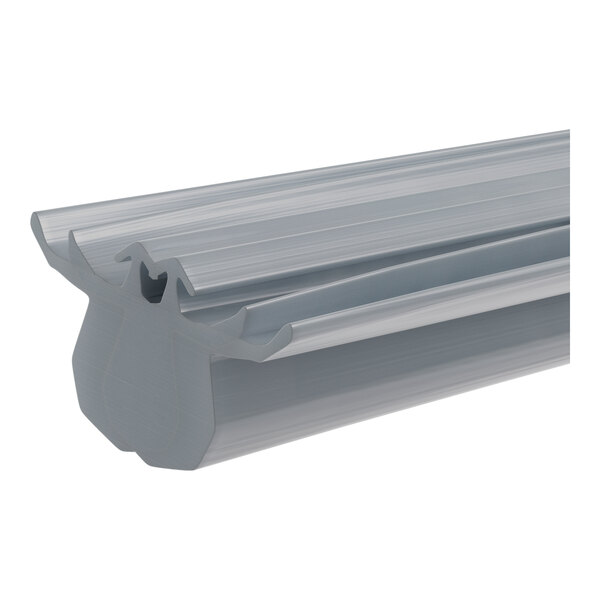A close-up of a grey metal profile with a long, thin plastic strip.