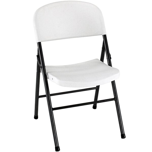 A 4 pack of white Bridgeport Essentials resin folding chairs with black steel frames.