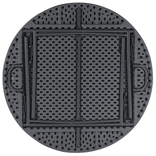 A gray ZOWN round folding table with holes in it.