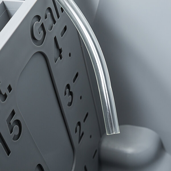 A Unger white plastic tube with numbers on it.