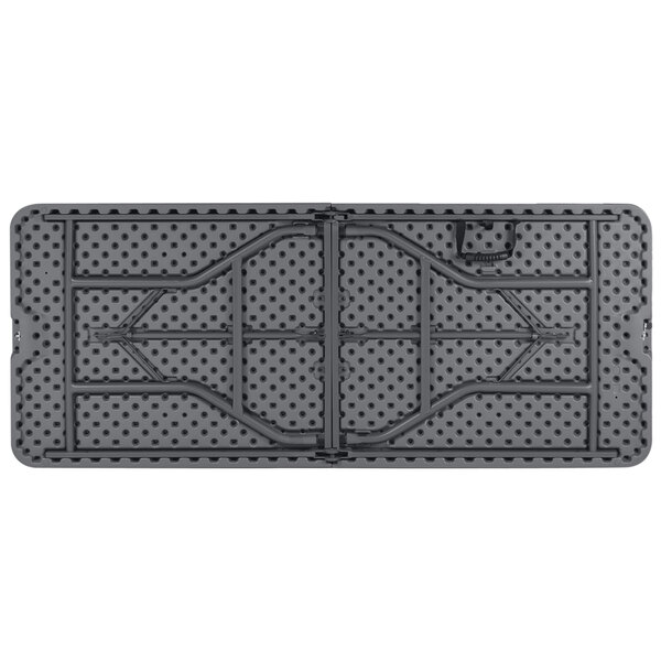 A gray ZOWN rectangular plastic folding table with black dots on it.