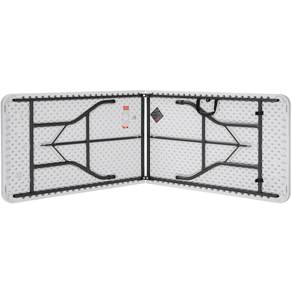 A white Bridgeport Essentials fold-in-half table with a steel frame.
