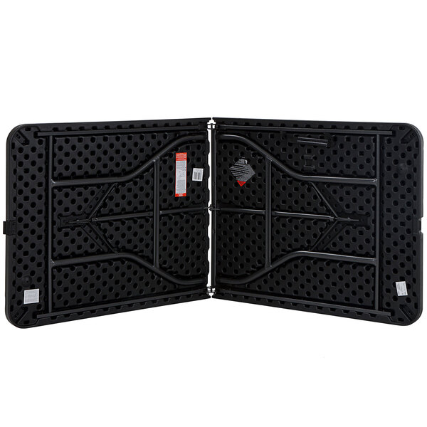 A black Bridgeport Essentials folding table with a steel frame and holes in it.