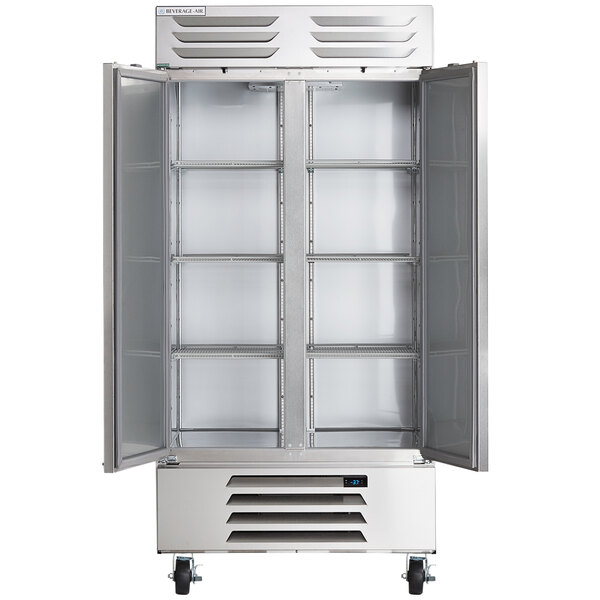 A silver Beverage-Air reach-in freezer with two open doors.