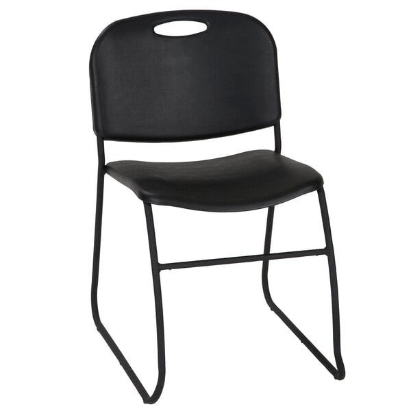 A pack of 4 black resin Bridgeport Essentials stacking chairs with metal legs.