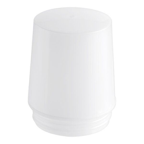 A white plastic cover with a black circle on top.