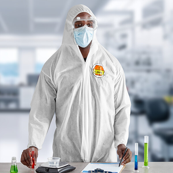 A man wearing Cordova white protective coveralls with elastic wrists and a hood.