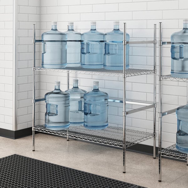 A Regency wire rack holding water jugs.