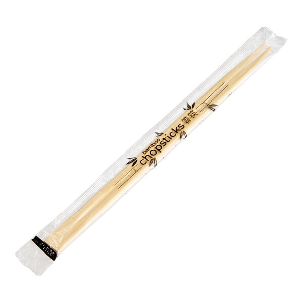 A pair of bamboo chopsticks in a clear plastic wrapper.