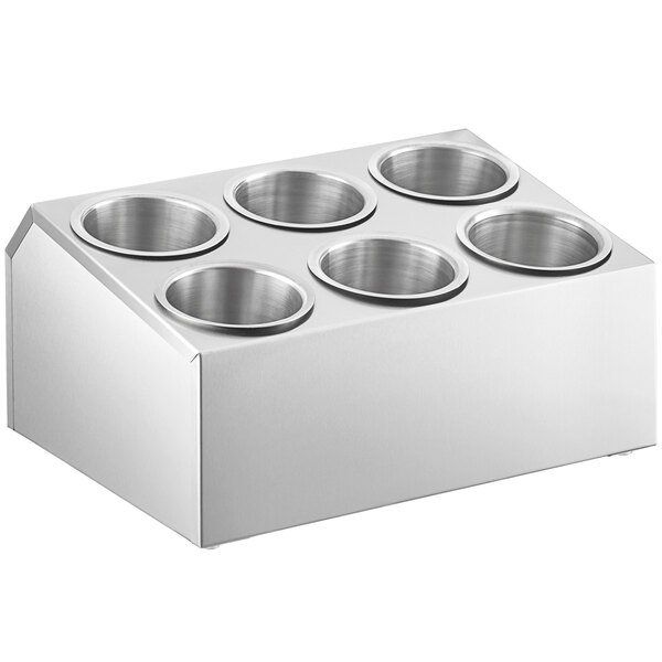A stainless steel flatware organizer with six stainless steel cylinders.