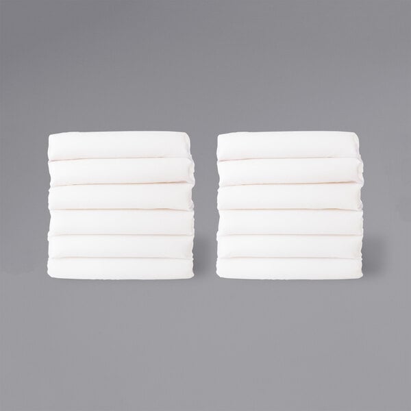 A stack of white folded sheets.