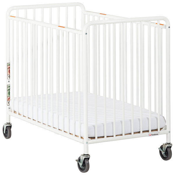 A white Foundations Chelsea crib with white wheels.