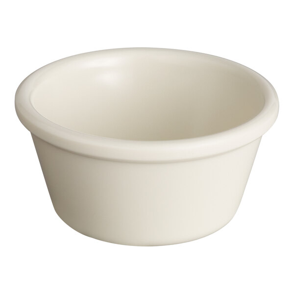 A small, round, bone white melamine ramekin.