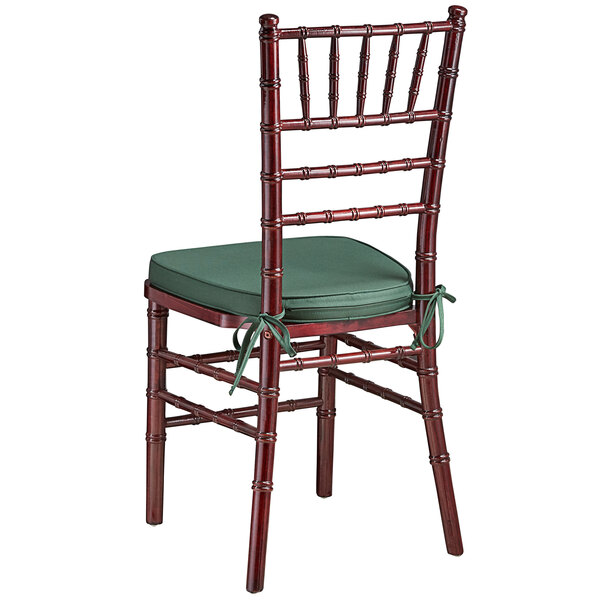 a chair with a green cushion