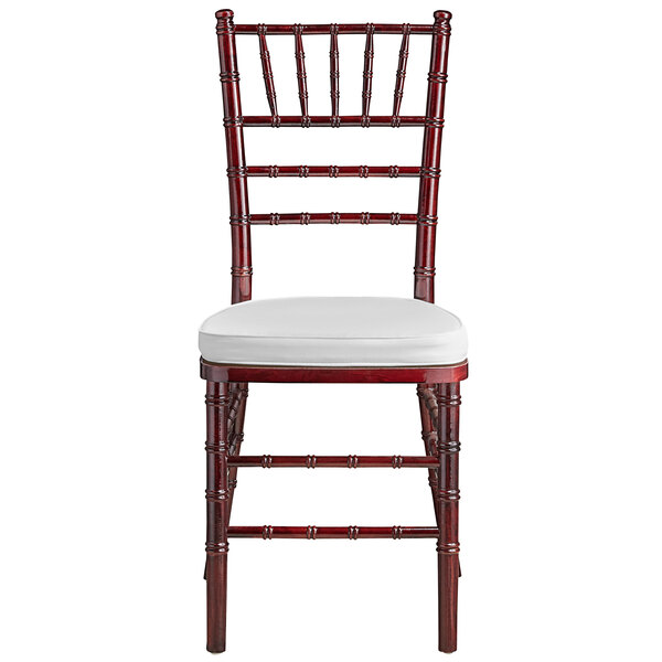 A Lancaster Table & Seating mahogany Chiavari chair with ivory cushion.