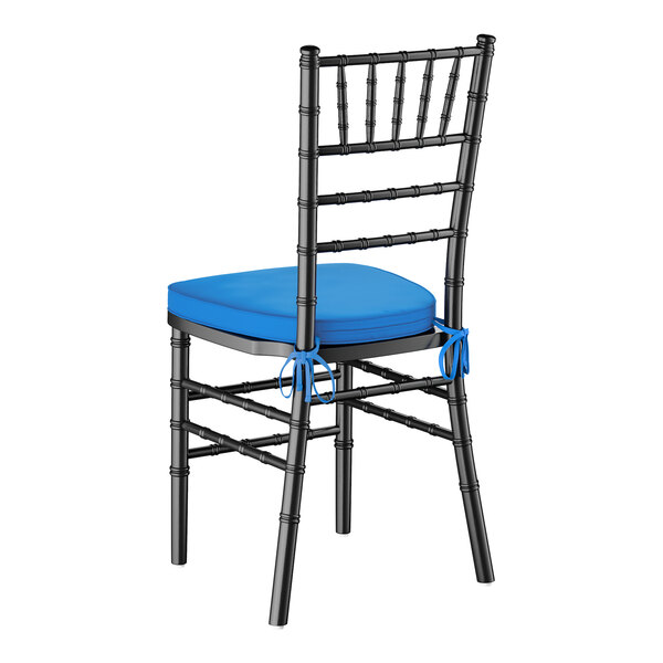 A black wood Chiavari chair with a blue cushion tied to the seat.