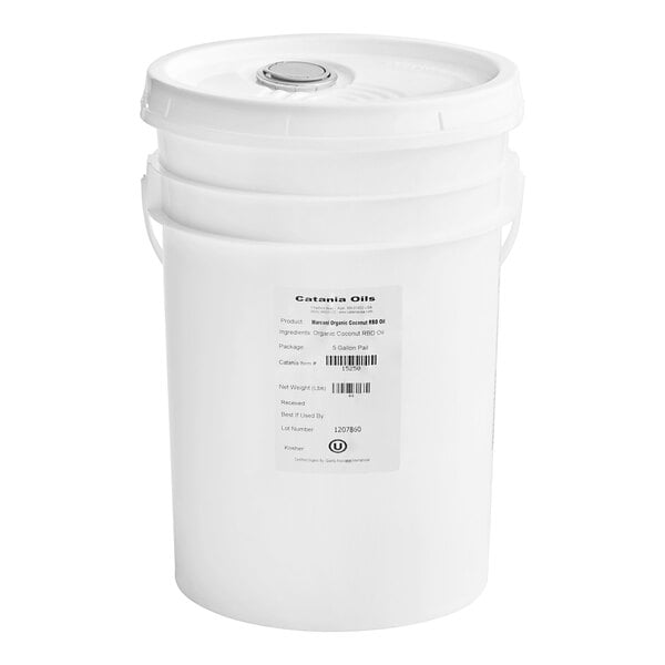 A white bucket with a label reading "Catania Spagna 100% Organic Coconut Oil"