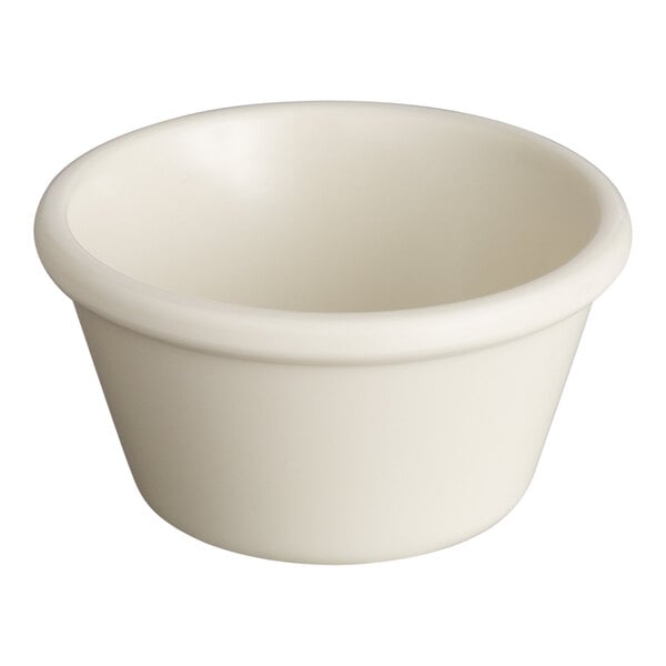 A small, bone white smooth melamine ramekin with a 4 oz. capacity.