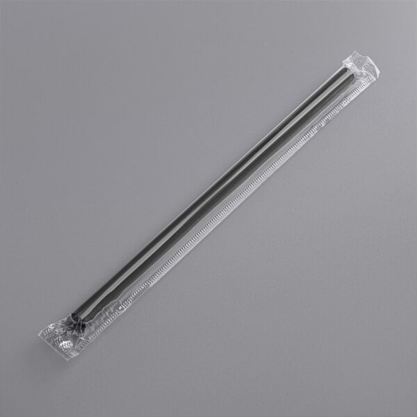 A plastic wrap with a long thin black straw