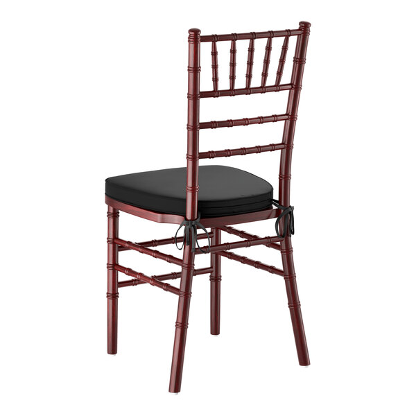 A mahogany wood Chiavari chair with a black cushion.