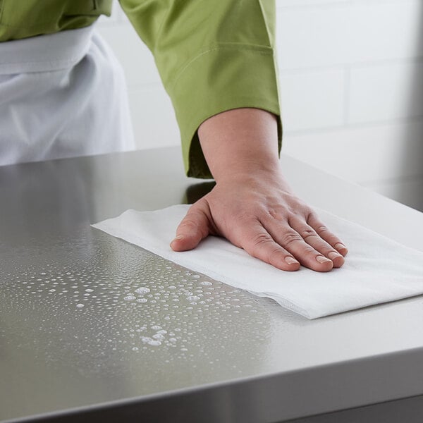 a hand on a paper towel