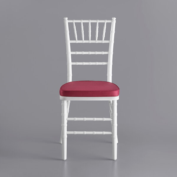 a red cushion with a white border