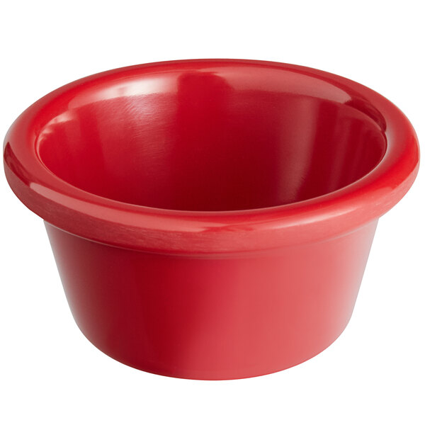 A close-up of a red Acopa melamine ramekin with a white background.
