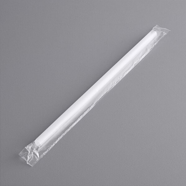 A white plastic bag containing a white translucent giant straw in a white tube.