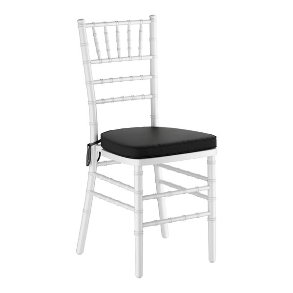 A white wood Chiavari chair with a black cushion.