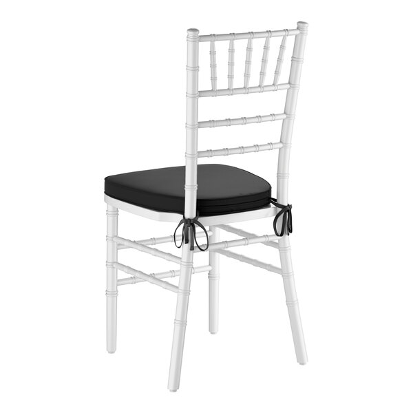 A white wood Chiavari chair with a black cushion tied to the seat.