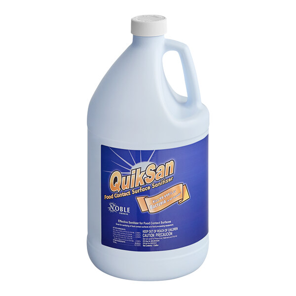 A white jug of Noble Chemical QuikSan surface sanitizer with a blue label.
