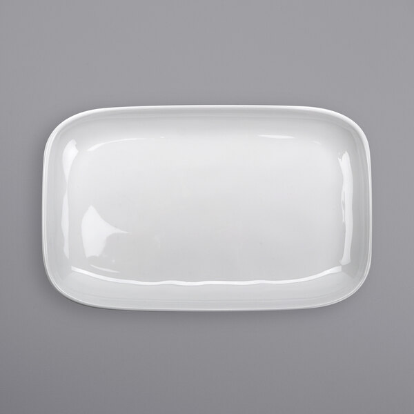 a white rectangular plate on a gray background