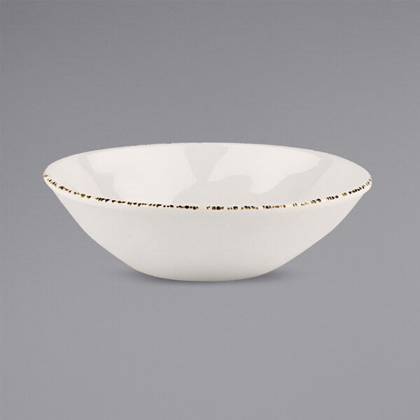 A white bowl with brown spots.