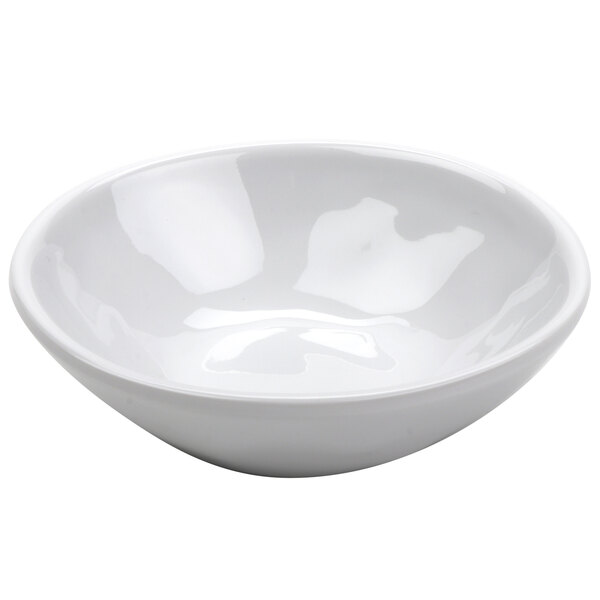 A white irregular melamine fruit dish with a white background.