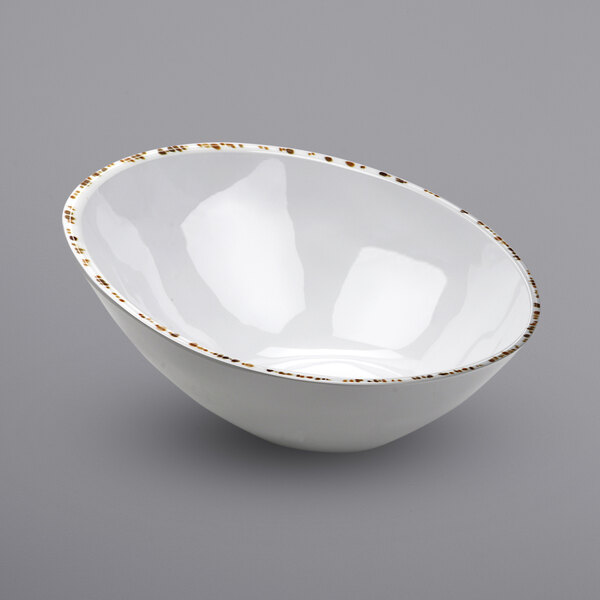 A white bowl with gold trim.